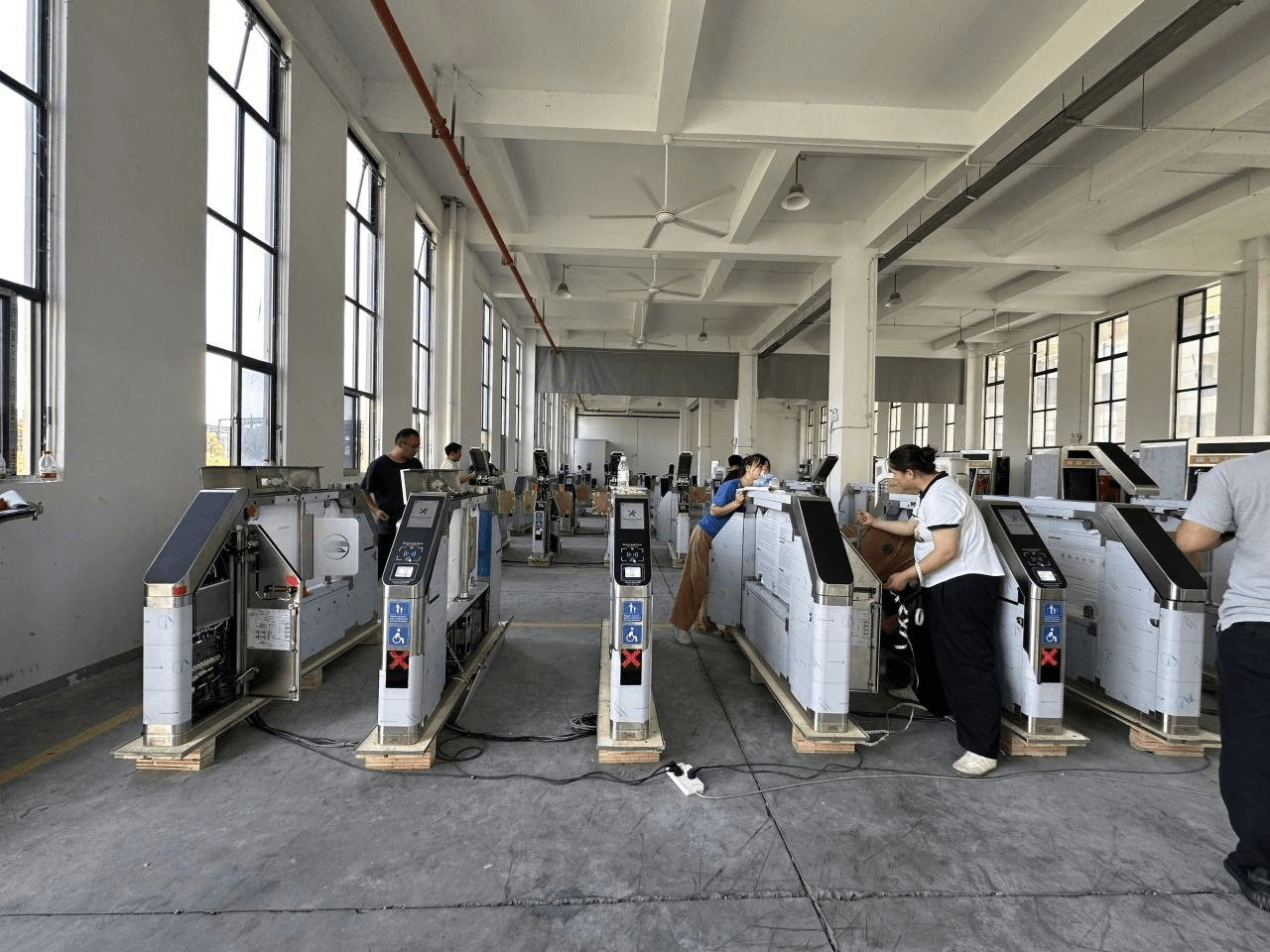 Top view of a team working on construction plans in an office setting.