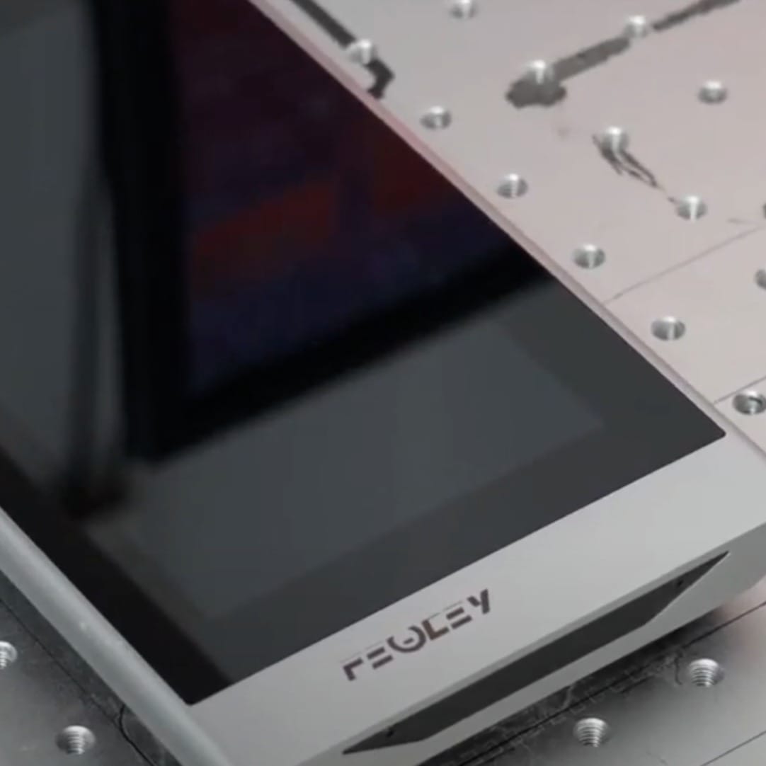 Top view of a team working on construction plans in an office setting.